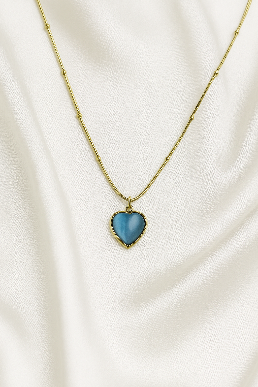 Zelra Blue Heart Pendant Necklace in Gold Finish (Imitation Jewelry)