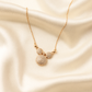 Zelra Crystal-Studded Bow Charm Necklace in Gold Finish (Imitation Jewelry)