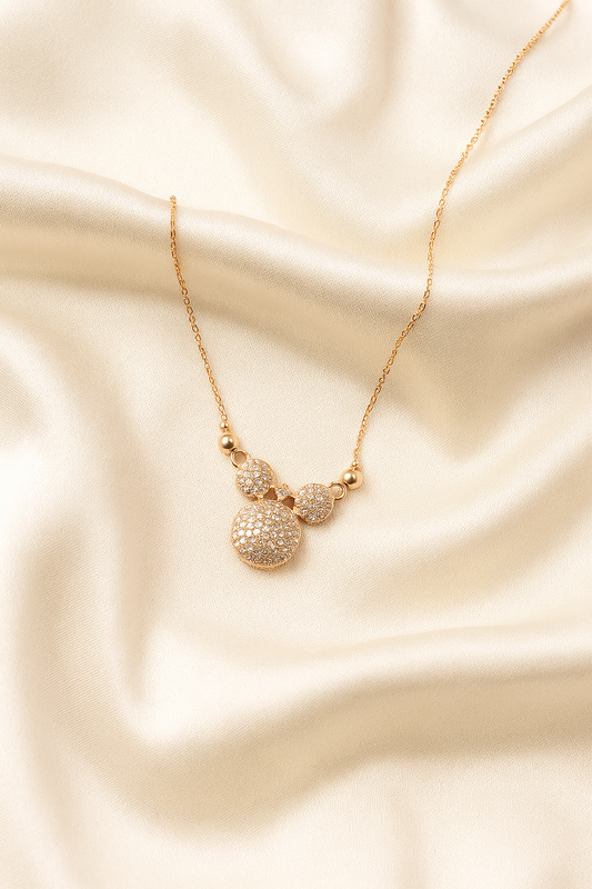 Zelra Crystal-Studded Bow Charm Necklace in Gold Finish (Imitation Jewelry)