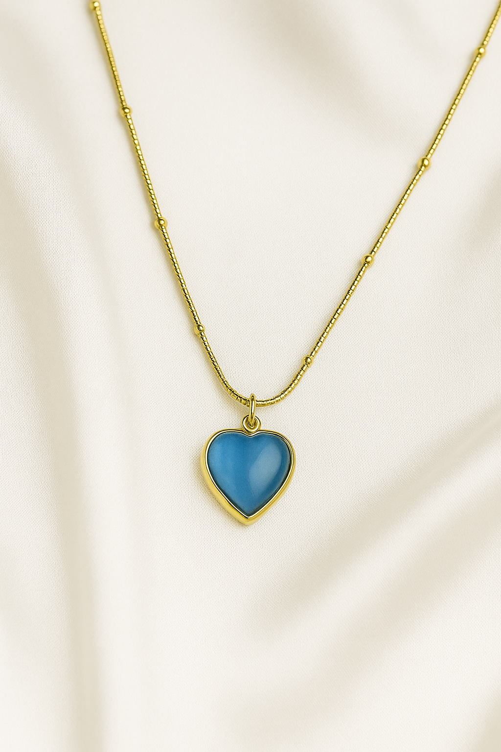 Zelra Blue Heart Pendant Necklace in Gold Finish (Imitation Jewelry)