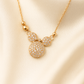 Zelra Crystal-Studded Bow Charm Necklace in Gold Finish (Imitation Jewelry)