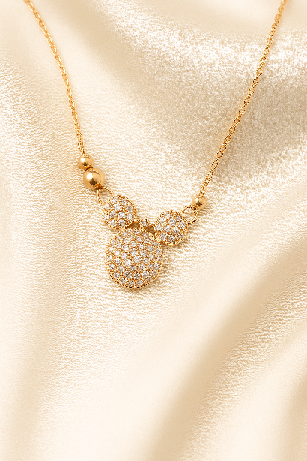 Zelra Crystal-Studded Bow Charm Necklace in Gold Finish (Imitation Jewelry)